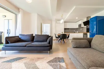a living room with a couch and a table at Le Casanelle in Aix-en-Provence