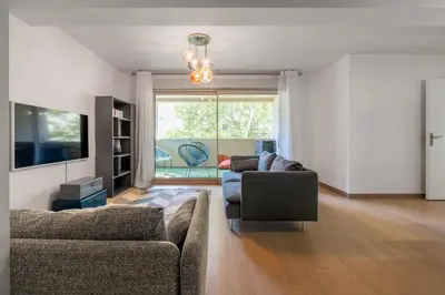 a living room with two couches and a television at Le Casanelle in Aix-en-Provence
