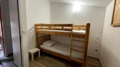 a room with two bunk beds in a room at Jolie maison avec piscine , proche du centre de Bédoin in Bédoin