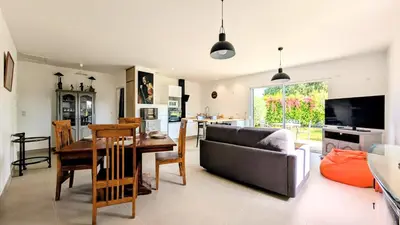 a bedroom with a white bed and wooden cabinets at Entre village et campagne in Velleron