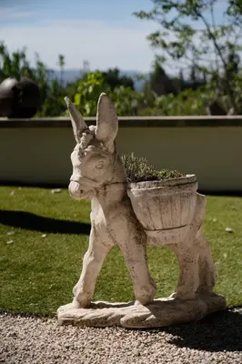 a statue of a rabbit holding a planter at Estate in Provence in Aix-en-Provence
