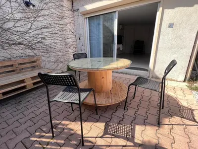 a table and chairs sitting on a patio at Studio Velaux in Velaux