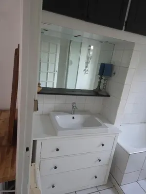 a bathroom with a white sink and a mirror at Provence Studio 33 m2 in Cavaillon