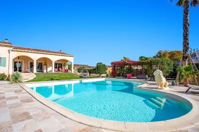 a swimming pool in the backyard of a house at Villa Valleron by Villa Plus in Saint-Saturnin-les-Avignon