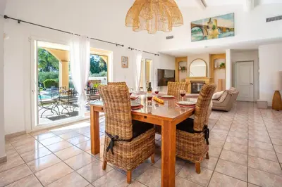 a dining room with a table and chairs at Villa Valleron by Villa Plus in Saint-Saturnin-les-Avignon