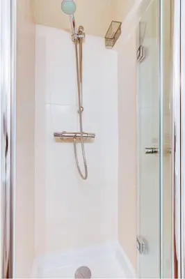 a bathroom with a shower with a glass door at Aude Loft in Aix-en-Provence