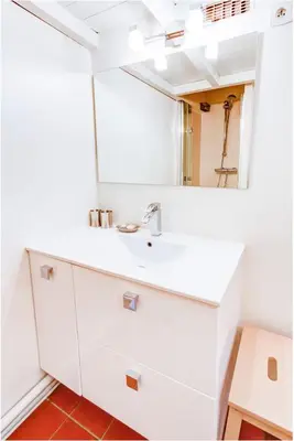 a bathroom with a sink and a mirror at Aude Loft in Aix-en-Provence