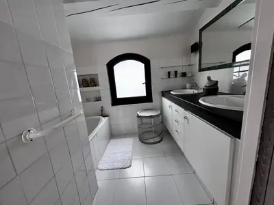 a bathroom with a sink and a tub and a toilet at Maison V in Ventabren