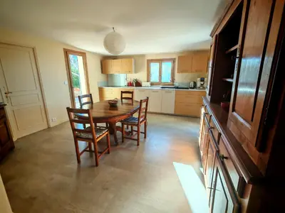 a kitchen with a dining room table and chairs at Villa provençale Les Agapanthes in Saint-Saturnin-les-Apt