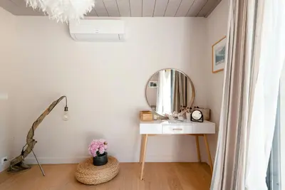 a dressing room with a mirror and a table at Modern Loft With Pool Near Lourmarin in Puget