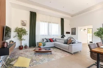 a living room with a couch and a table at Aria Blue - Spacieuse - Climatisée - Piscine in Lançon-Provence