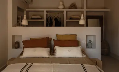a bedroom with a bed with two pillows on it at Maison Rosalie in Carpentras
