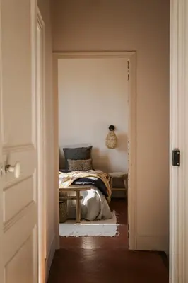 a bedroom with a bed in the corner of a room at Maison Rosalie in Carpentras