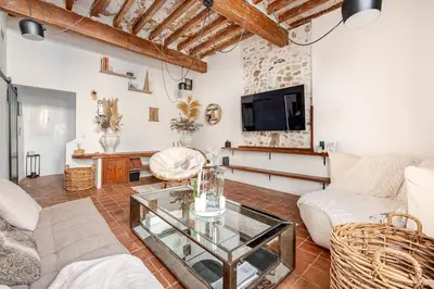 a living room with a couch and a table at Exceptional apartment in Aix-en-Provence