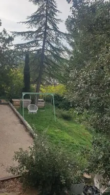 a playground in a yard with a goal at Petite maison sur Apt in Apt