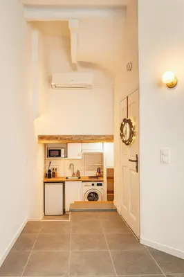 a kitchen with a sink and a stove at Cozy et elegant studio Aix en Provence centre in Aix-en-Provence