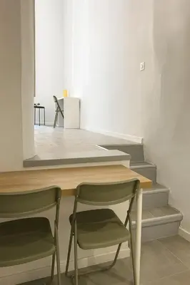 a dining room with a table and two chairs at Cozy et elegant studio Aix en Provence centre in Aix-en-Provence