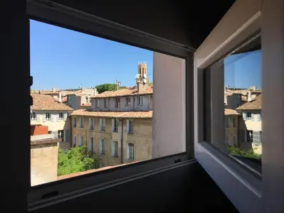 a view of a city from a window at Cocon cosy et calme au coeur du centre historique in Aix-en-Provence