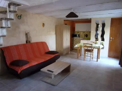 a living room with a couch and a table at Les Granges in Villars