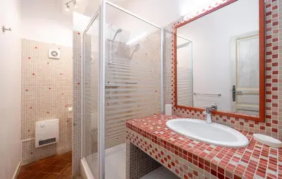 a bathroom with a sink and a mirror at Maison De Charme in Jonquerettes