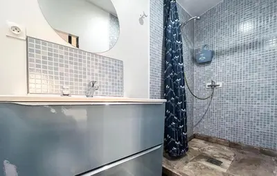a bathroom with a sink and a shower at Cozy Home In Miramas With Outdoor Swimming Pool in Miramas