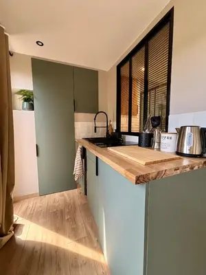 a kitchen with a sink and a counter top at Studio tout confort dans la campagne aixoise in Le Puy-Sainte-Réparade
