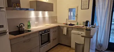 a kitchen with a sink and a stove at Charming village house in Éguilles