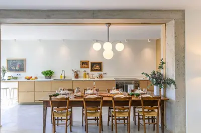a kitchen with a large wooden table and chairs at Le Hameau des Sources Lourmarin Luberon in Lourmarin