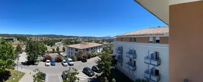 an overhead view of a parking lot next to a building at Charmant appartement hotel calme à Aix en Provence in Aix-en-Provence