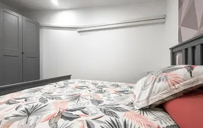 a bedroom with a bed with a colorful comforter at Awesome Home In Miramas With Swimming Pool in Miramas