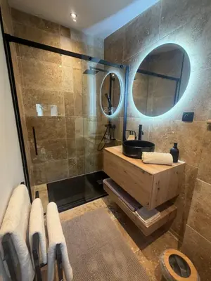 a bathroom with a sink and a shower at Charmant appartement T2 cosy avec piscine in Mollégès