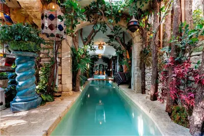 an indoor pool in a building with plants at Signature Home Pool & Panoramic Terrace in Goult