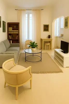 a living room with a couch and a table at T2 calme centre Aix Clim Fibre in Aix-en-Provence
