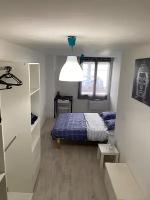 a small bedroom with a bed and a window at The Provençal orchid in Malemort-du-Comtat
