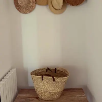 a basket sitting on a table in a room at Superbe mas provençal avec piscine dans le Luberon in Lagnes