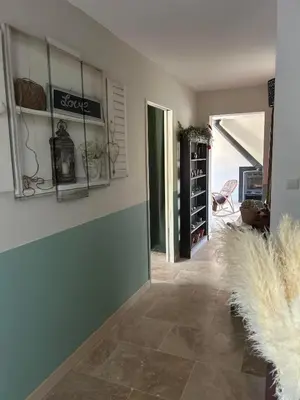 a room with a wall with glass shelves at Mas des Côtes in Saint-Hippolyte-le-Graveyron