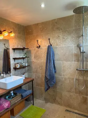 a bathroom with a sink and a shower at Mas des Côtes in Saint-Hippolyte-le-Graveyron