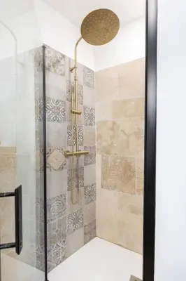 a bathroom with a shower with a glass door at Modern studio Le Renoir - Center of city - WiFi in Aix-en-Provence