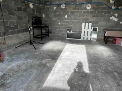 a shadow of a person taking a picture in a room at Le gîte des granges in Bédoin