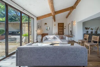 a living room with a couch and a table at Bastide de Guby in Saint-Saturnin-les-Apt