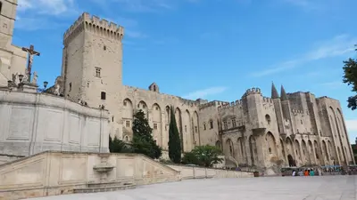 a large castle with a cross on top of it at Ventoux gîtes - appartements typiques avec vue sur le Mont Ventoux in Caromb