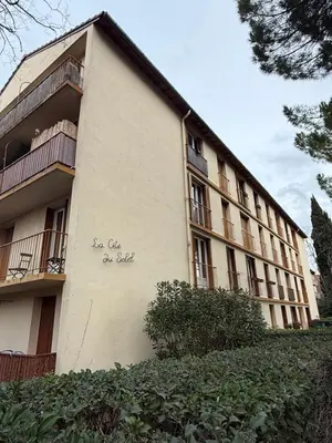 a building with writing on the side of it at Appartement moderne 3 chambres avec parking sécurisée in Aix-en-Provence