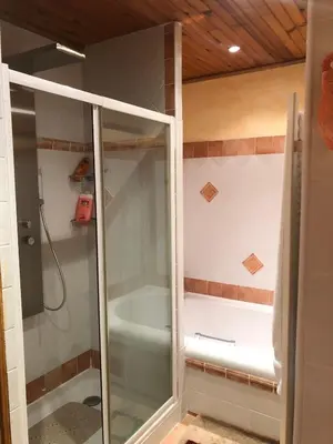 a glass shower in a bathroom with a tub at Farm House, 10 min d'Avignon in Jonquerettes