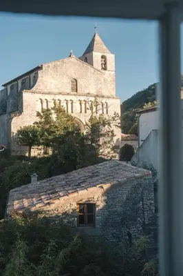 an old building with a tower on top of it at Auberge du Presbytère in Saignon