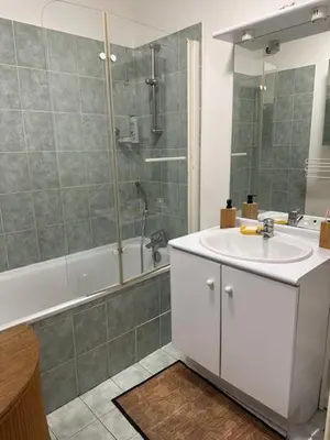 a bathroom with a sink and a shower and a tub at Calme T2, Wifi, Proche centre et sites culturels, Vue magnifique in Aix-en-Provence