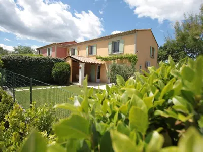 a house seen through the bushes at Holiday Home Die Gîtes de Bel-Air im Luberon in der Provence by Interhome in Les Taillades
