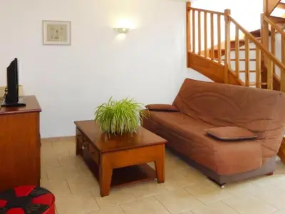 a living room with a couch and a table at Apartment Morard - Bonnieux Appt Les Ocres by Interhome in Bonnieux