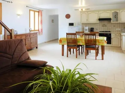 a kitchen and dining room with a table and chairs at Apartment Morard - Bonnieux Appt Les Ocres by Interhome in Bonnieux
