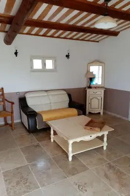 a living room with a couch and a coffee table at Holiday Home Provenzalisches Ferienhaus mit Charme auf dem Land mit Pool by Interhome in Villars