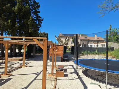 a playground with a trampoline at Apartment Leonie's Gîte Moulin de Tartay in Avignon by Interhome in Avignon